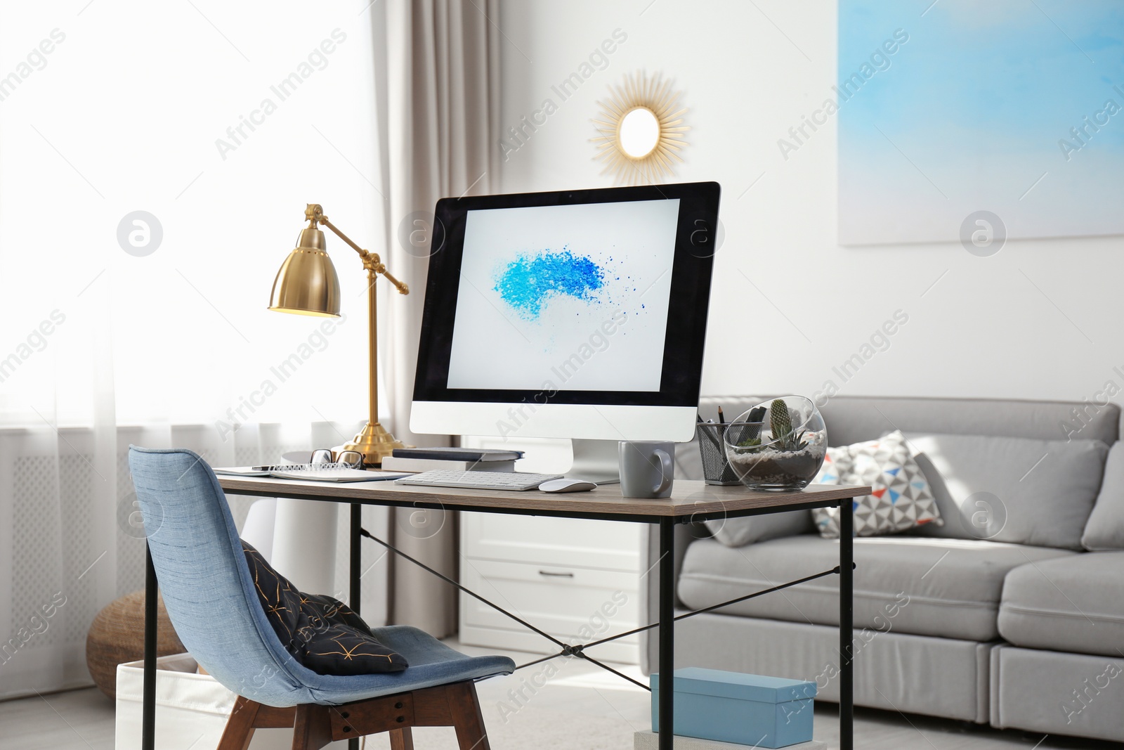 Photo of Comfortable workplace with modern computer on desk. Home office