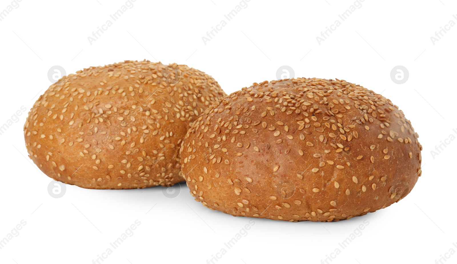 Photo of Two fresh hamburger buns with sesame seeds isolated on white