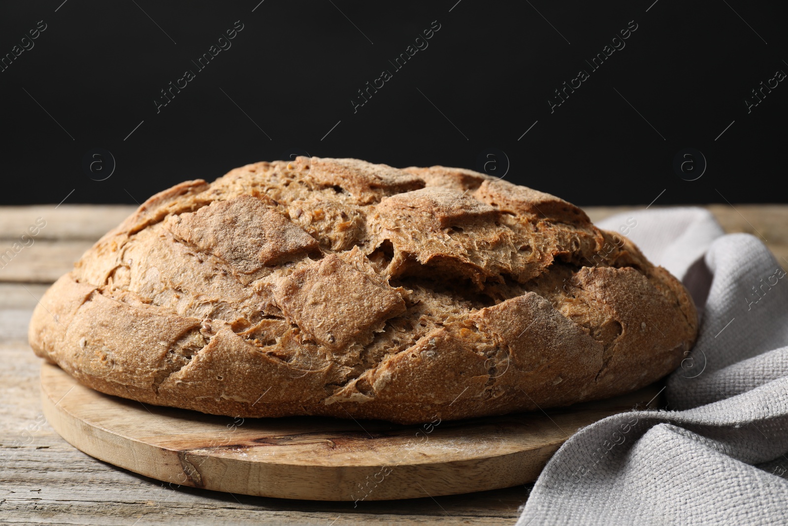 Photo of Freshly baked sourdough bread on wooden table