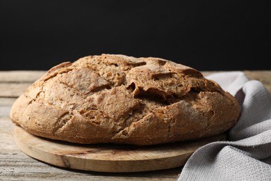 Freshly baked sourdough bread on wooden table