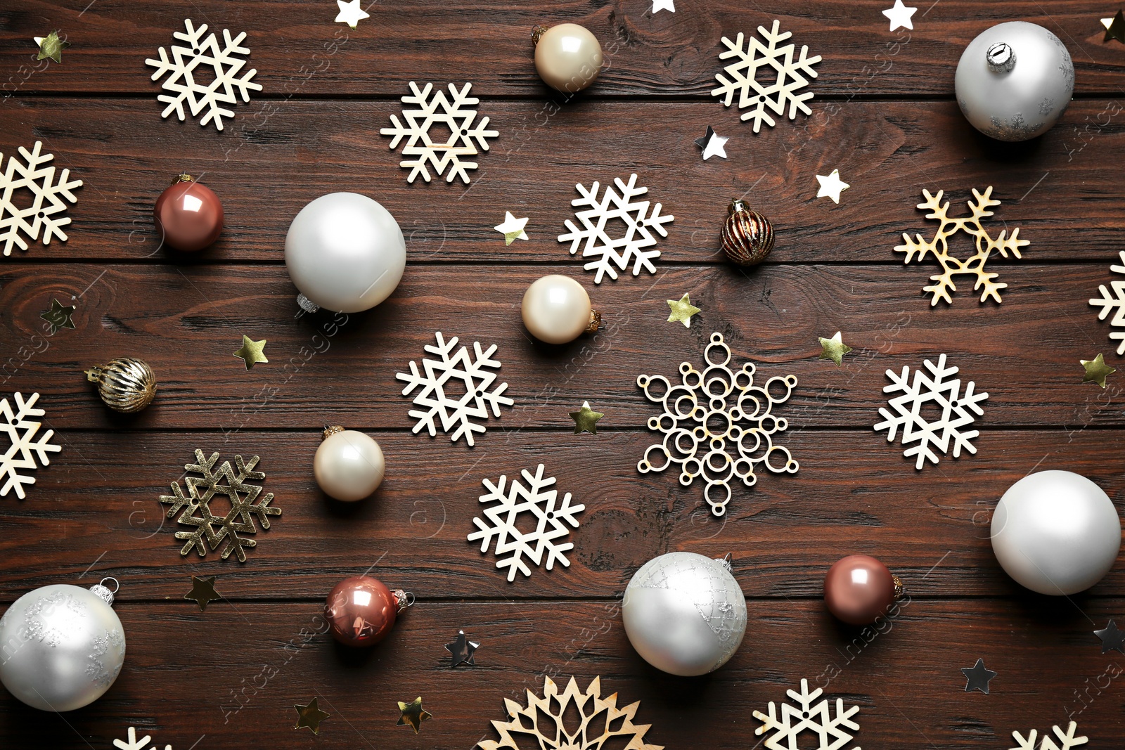 Photo of Flat lay composition with Christmas decorations on wooden background. Winter season