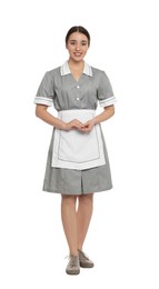 Full length portrait of young chambermaid in tidy uniform on white background