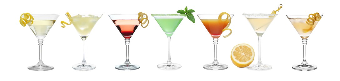Set with different cocktails in martini glasses on white background