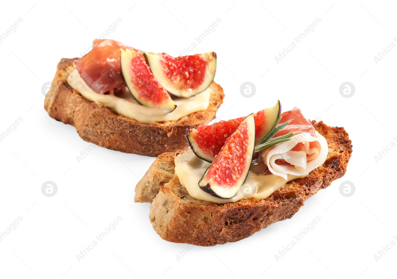 Photo of Bruschettas with cream cheese, prosciutto and figs isolated on white