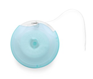 Container with dental floss on white background, top view