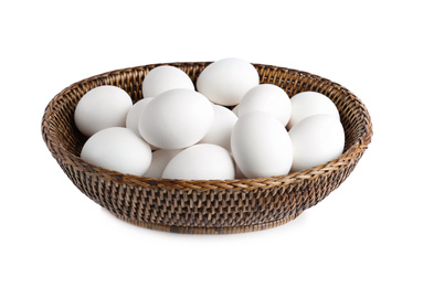 Chicken eggs in wicker bowl isolated on white