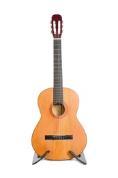 Photo of Acoustic guitar on stand against white background