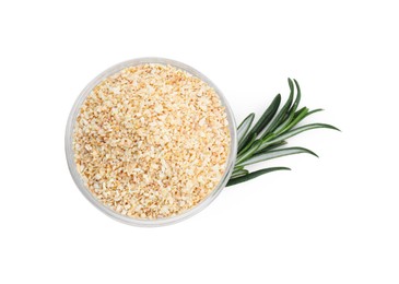 Dehydrated garlic granules in bowl and rosemary isolated on white, top view