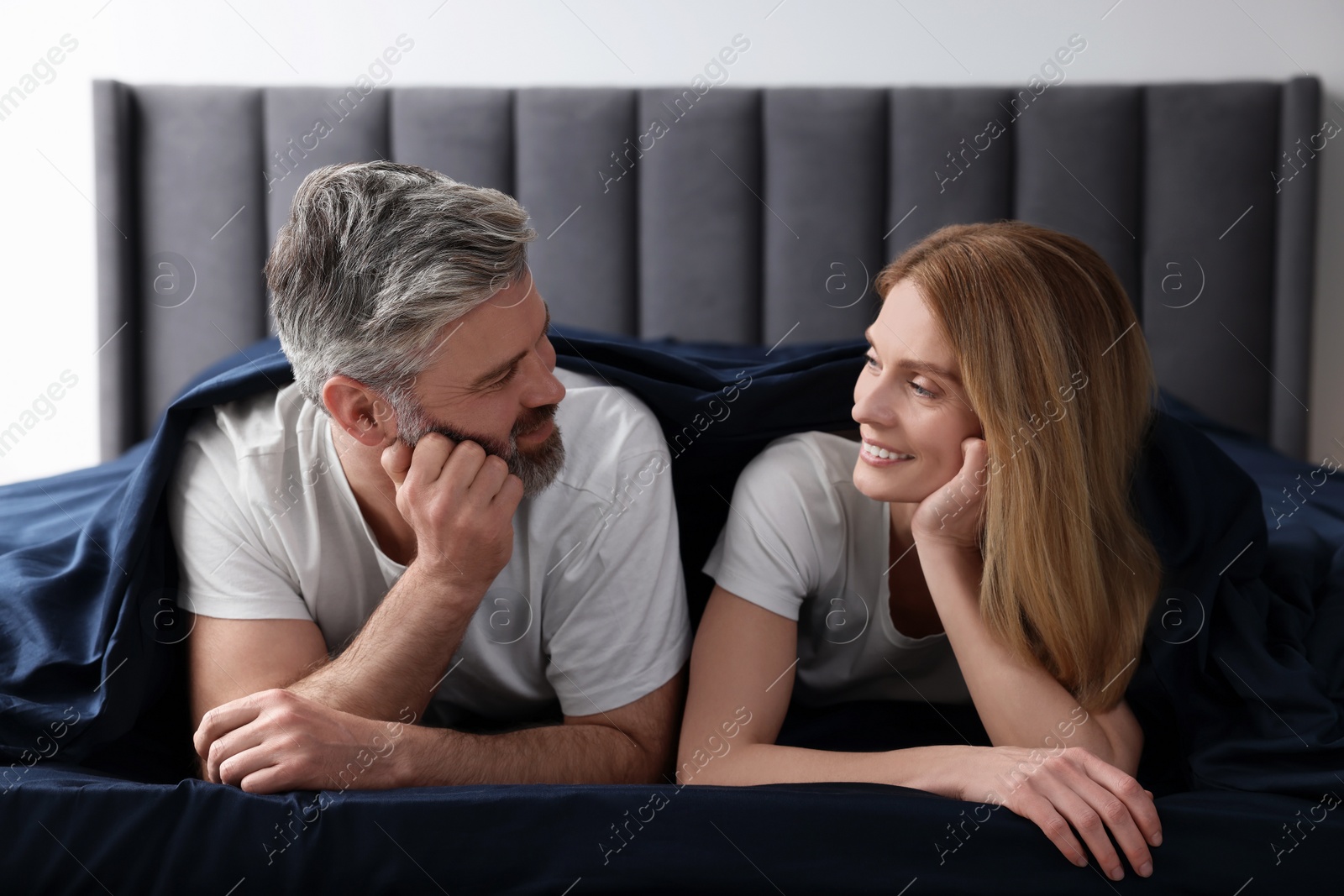 Photo of Lovely mature couple in bed at home