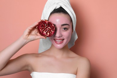 Photo of Woman with pomegranate face mask and fresh fruit on  pale coral background