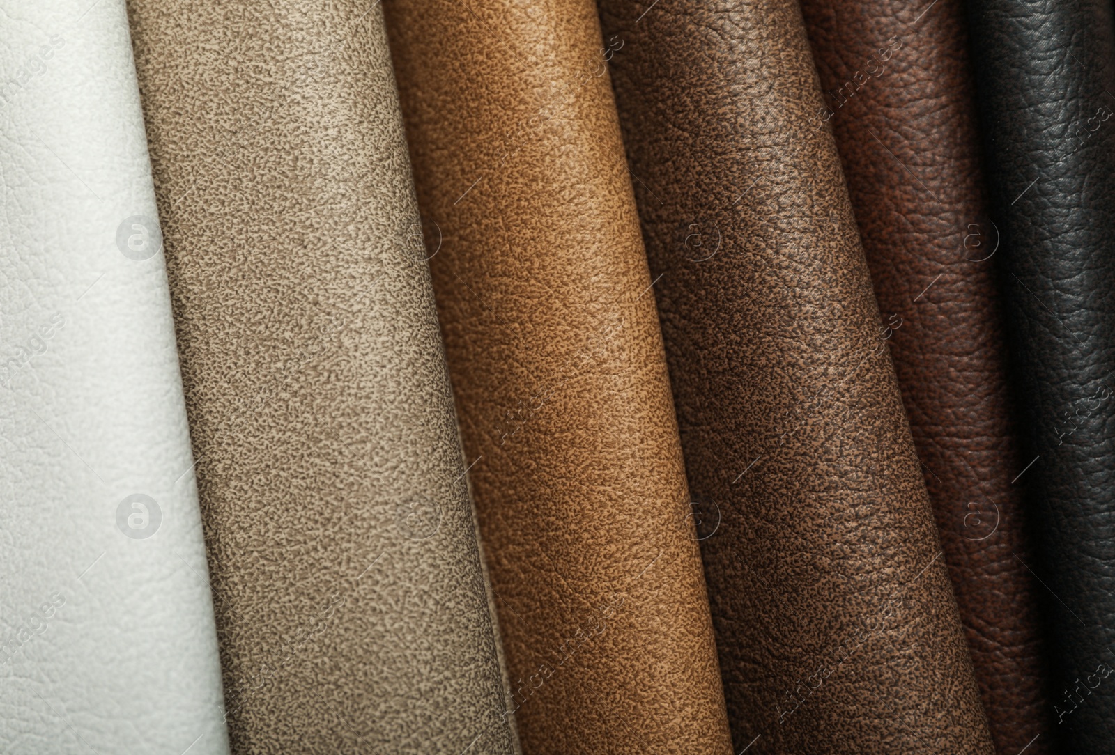 Photo of Different leather samples as background, closeup view