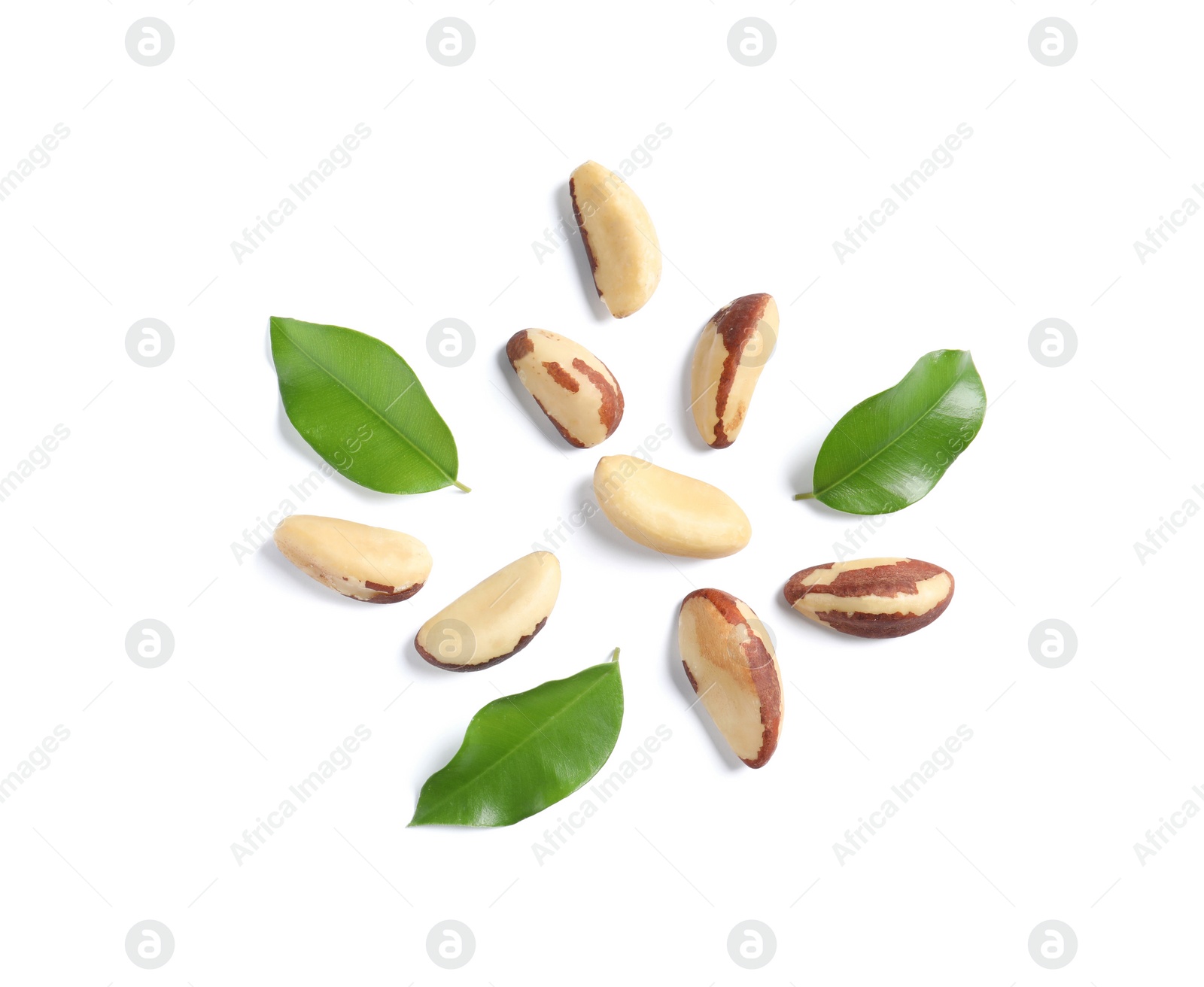 Photo of Composition with Brazil nuts and leaves on white background, top view
