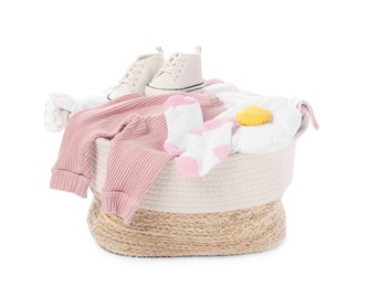 Photo of Laundry basket with baby clothes and shoes isolated on white