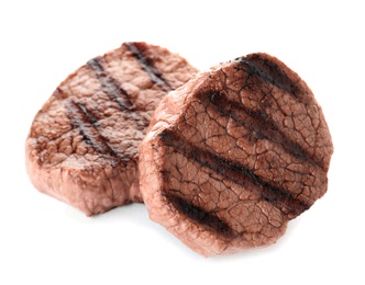 Photo of Delicious grilled steaks on white background. Fried meat