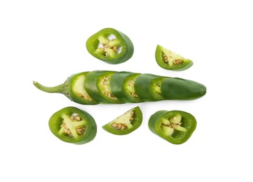 Photo of Whole and cut green hot chili peppers on white background, flat lay