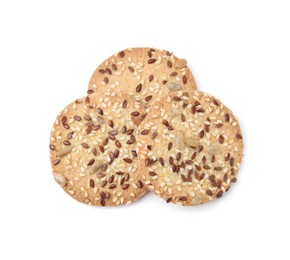 Photo of Round cereal crackers with flax, sunflower and sesame seeds isolated on white, top view