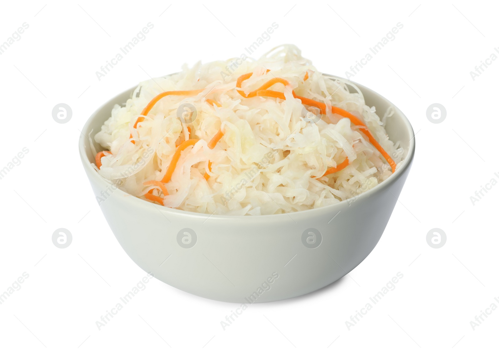 Photo of Bowl of tasty fermented cabbage isolated on white