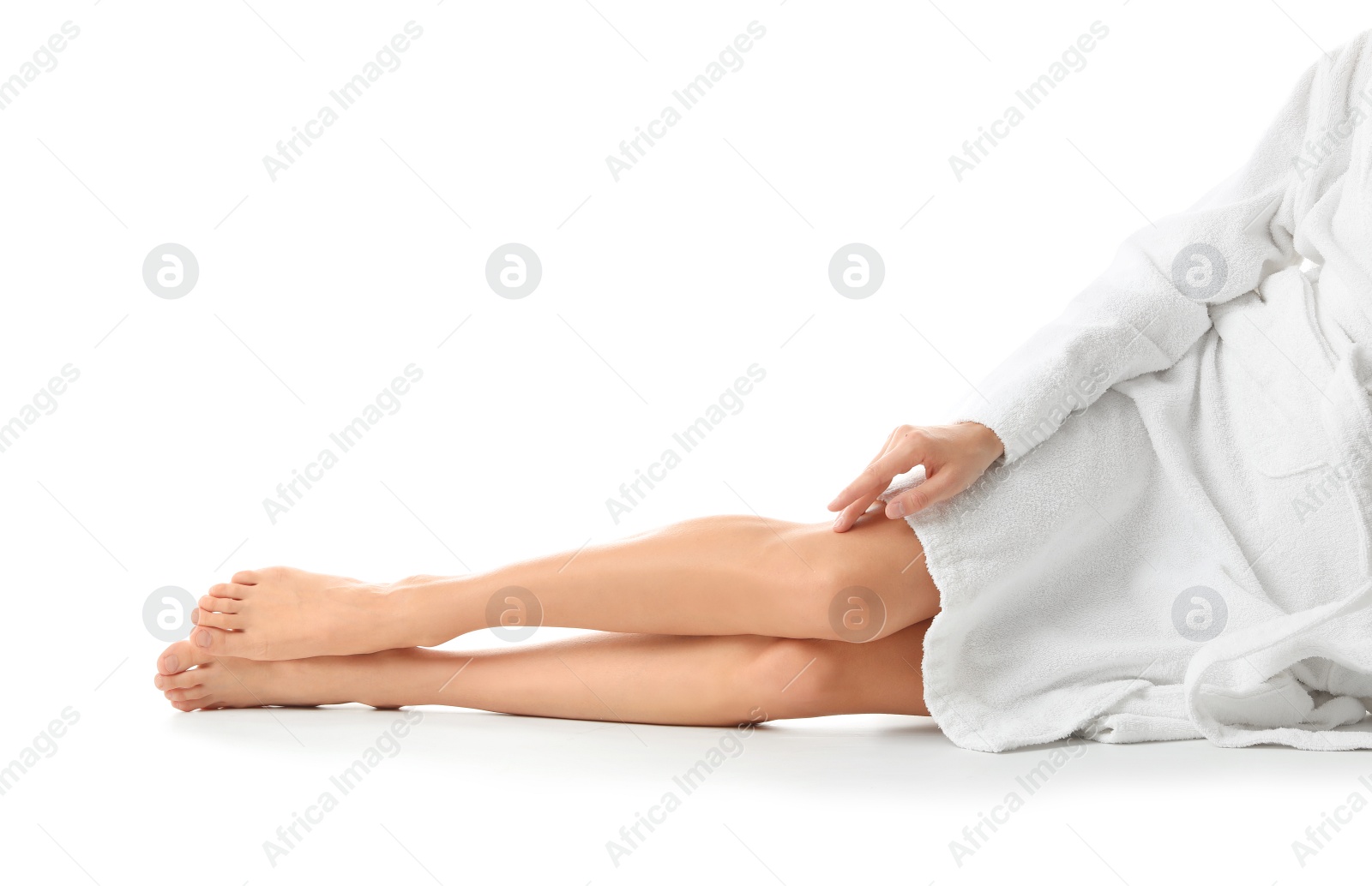 Photo of Young woman with beautiful long legs on white background, closeup