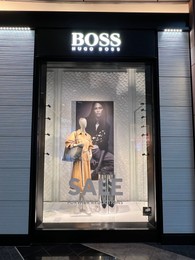WARSAW, POLAND - JULY 17, 2022: Hugo Boss store display with women clothes on mannequin in shopping mall
