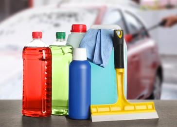 Image of Cleaning supplies on wooden surface at car wash