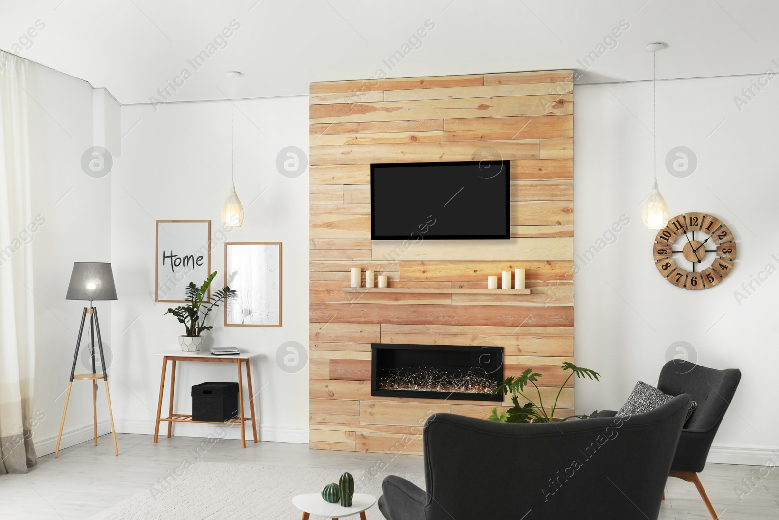 Photo of Living room interior with decorative fireplace in wooden wall