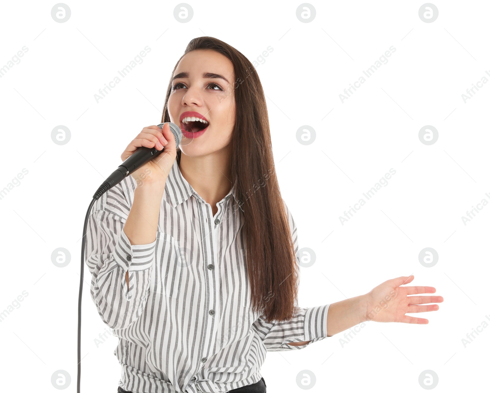 Photo of Young woman wearing casual clothes singing in microphone on white background