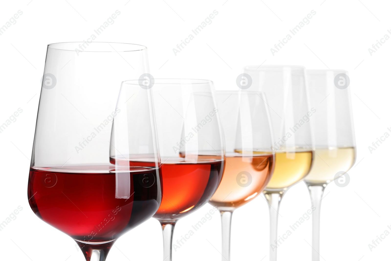 Photo of Row of glasses with different wines on white background