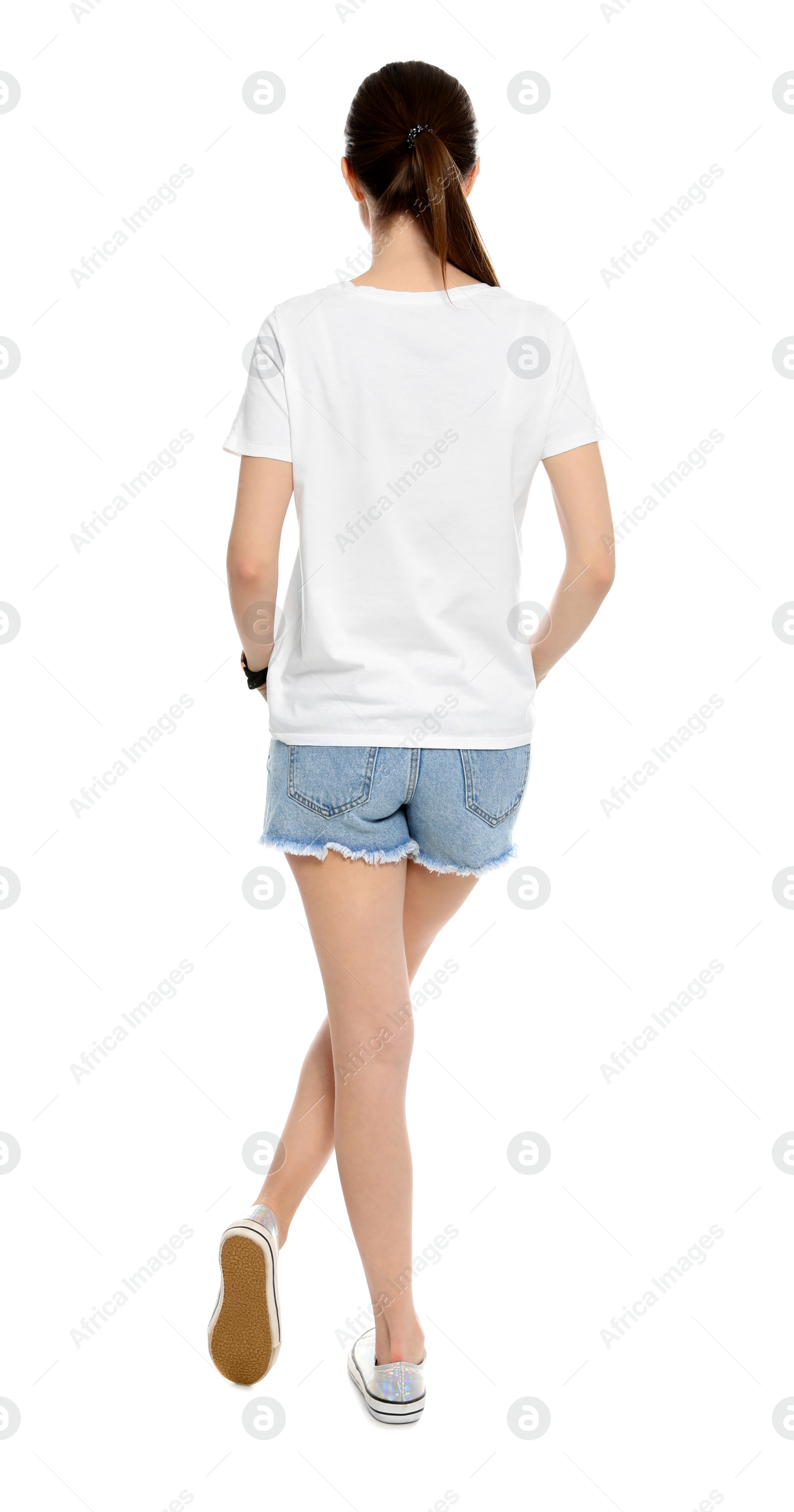 Photo of Young woman in t-shirt on white background. Mock up for design