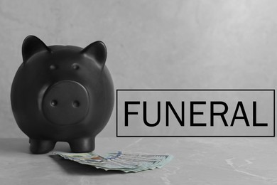 Money for funeral expenses. Black piggy bank and dollar banknotes on grey marble table