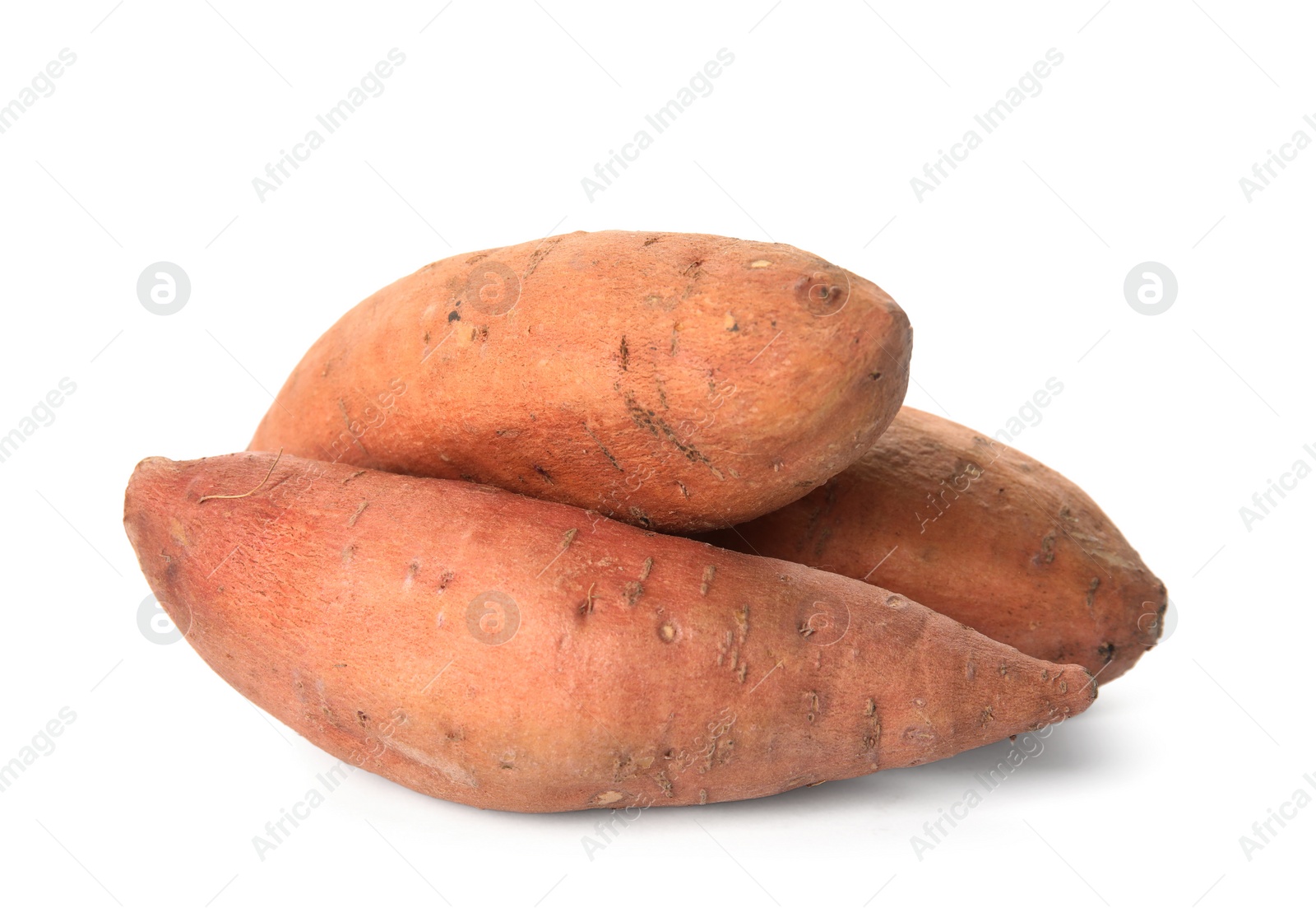 Photo of Heap of whole ripe sweet potatoes on white background