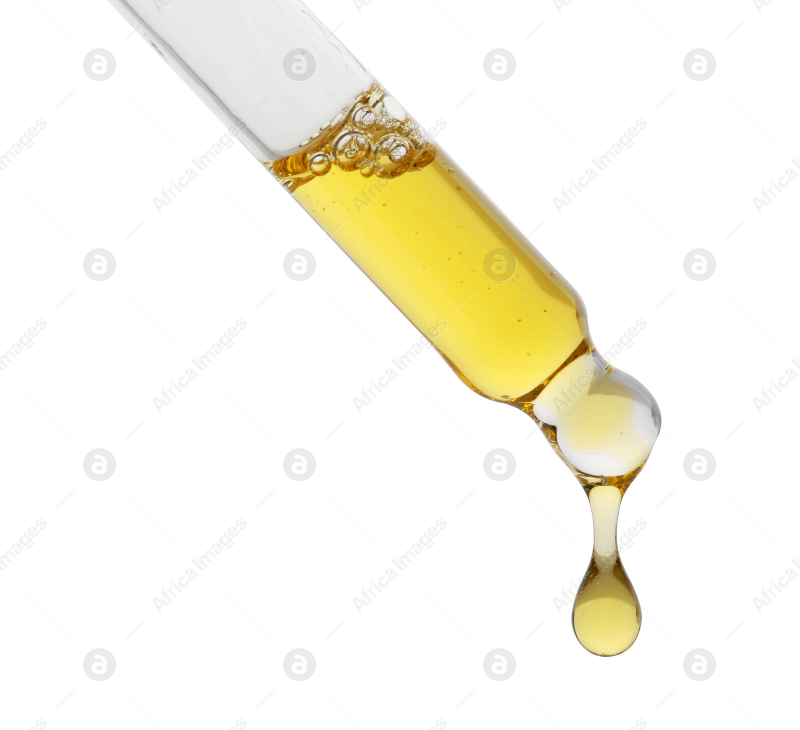 Photo of Dripping tincture from pipette isolated on white