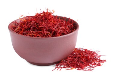 Dried saffron and bowl on white background