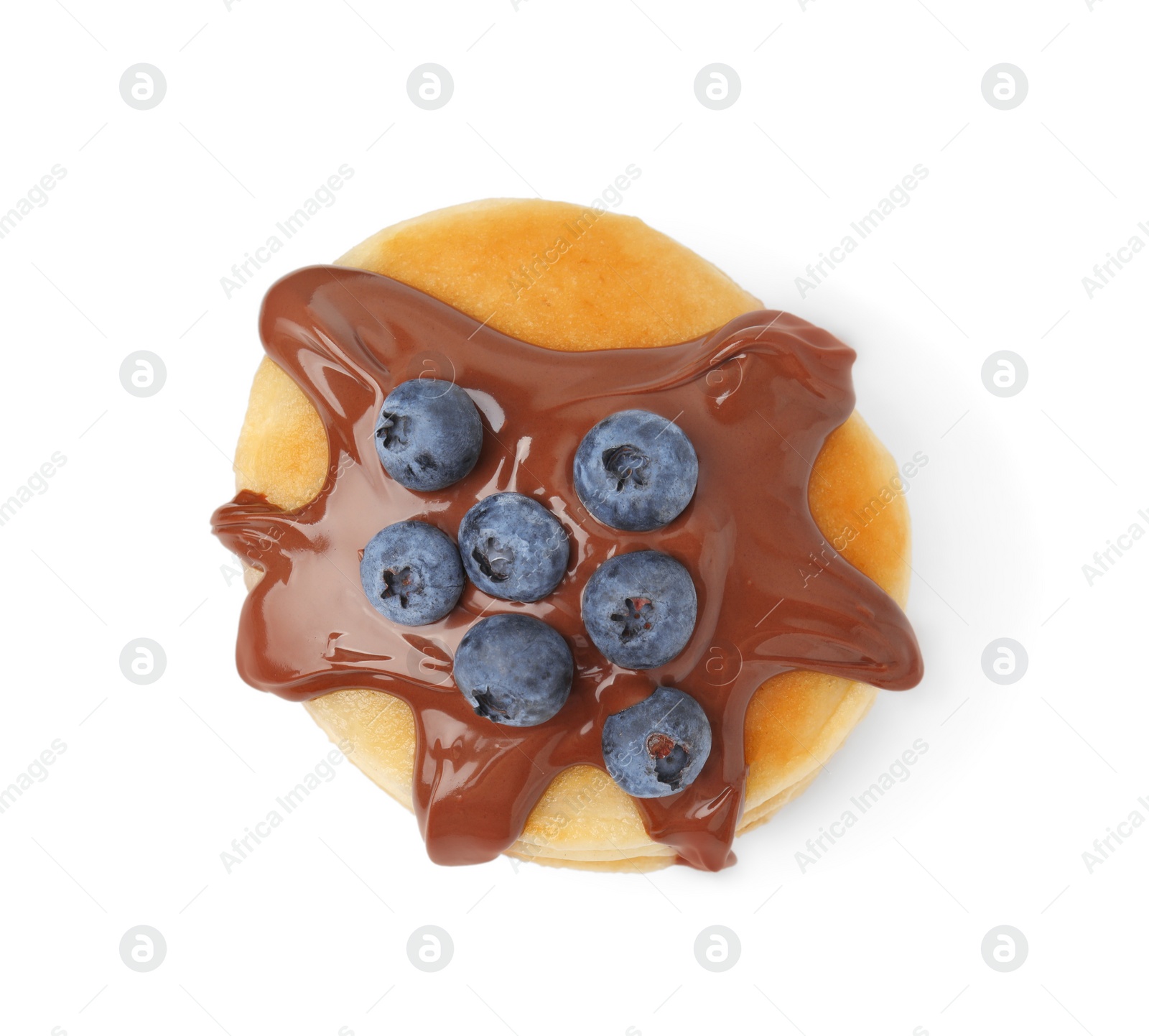 Photo of Tasty pancake with chocolate spread and blueberries isolated on white, top view