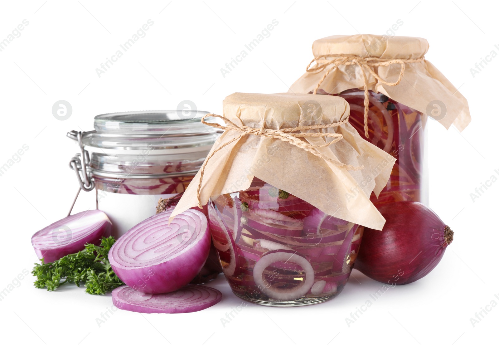 Photo of Jars of pickled onions isolated on white