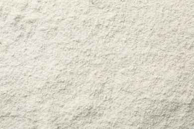 Photo of Oat flour as background, top view. Gluten free product