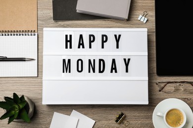 Photo of Flat lay composition of lightbox with phrase Happy Monday at workplace