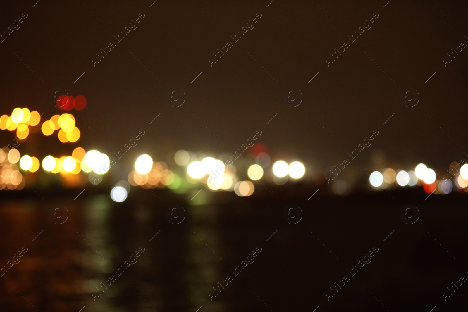 Photo of Blurred view of port at night. Bokeh effect