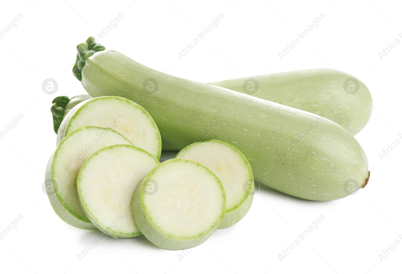 Photo of Fresh ripe green zucchinis isolated on white