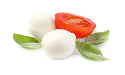 Delicious mozzarella, tomato and basil leaves on white background