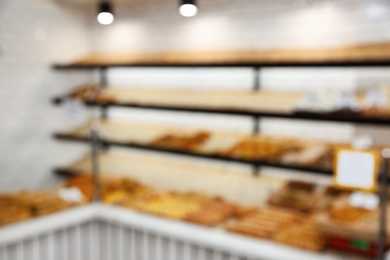 Photo of Blurred view of bakery store with pastries