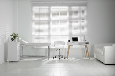 Photo of Doctor's office interior with modern workplace in clinic