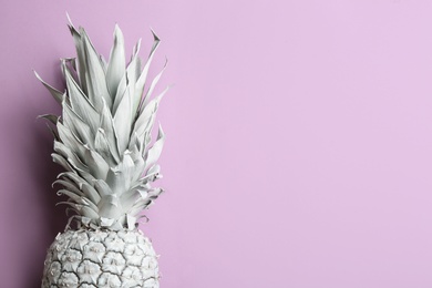 Photo of White pineapple on light background, top view with space for text. Creative concept