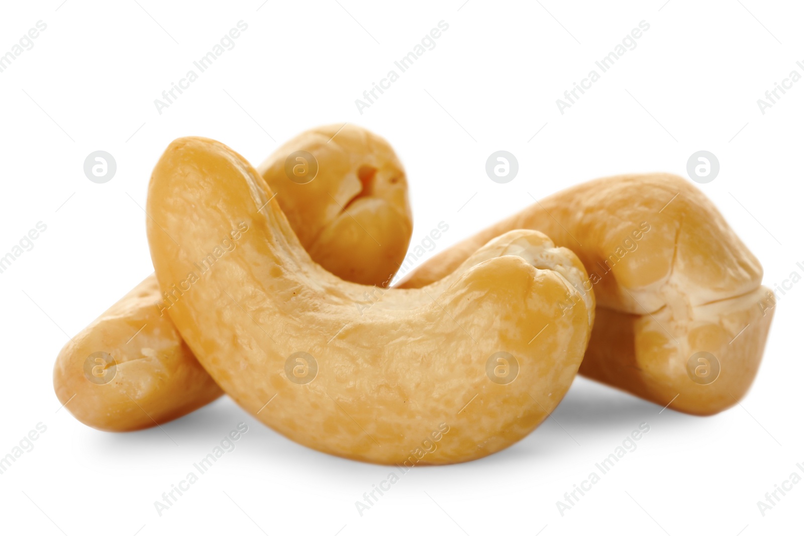 Photo of Pile of tasty organic cashew nuts isolated on white