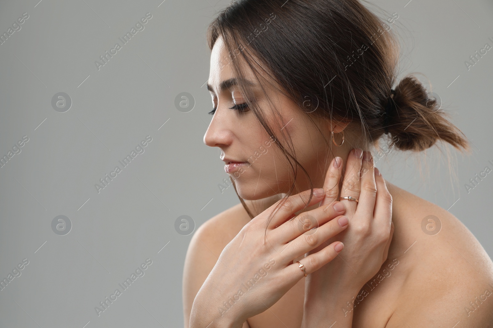 Photo of Portrait of beautiful woman on grey background