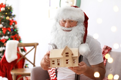 Authentic Santa Claus making toy in workshop