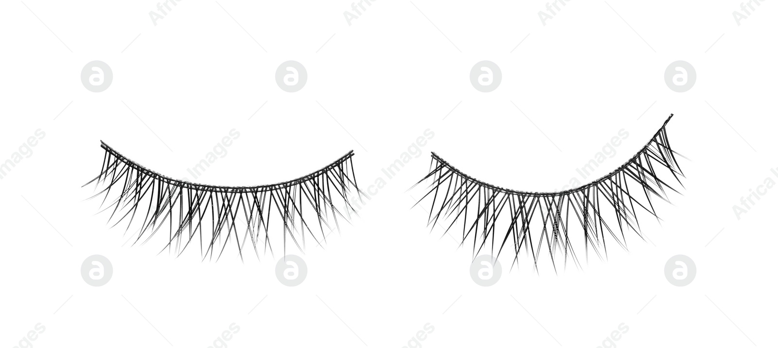 Photo of Fake eyelashes on white background, top view. Makeup product