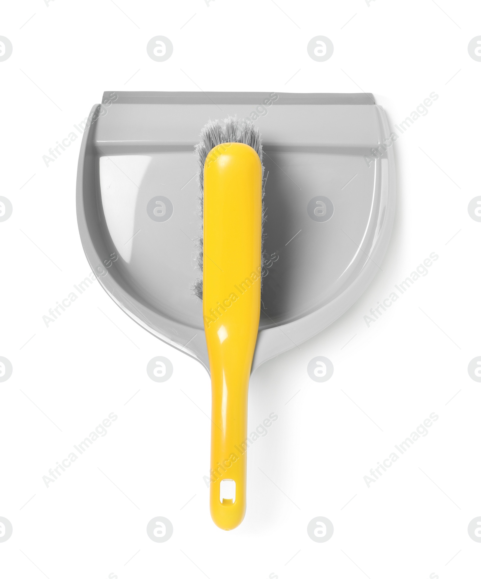 Photo of Plastic hand broom and dustpan isolated on white, top view