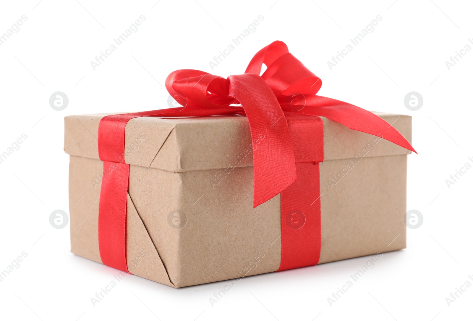 Photo of Christmas gift box decorated with ribbon bow on white background