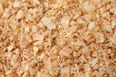 Photo of Pile of natural sawdust as background, top view