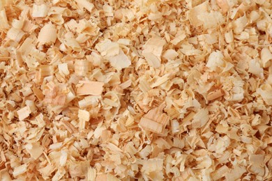 Pile of natural sawdust as background, top view